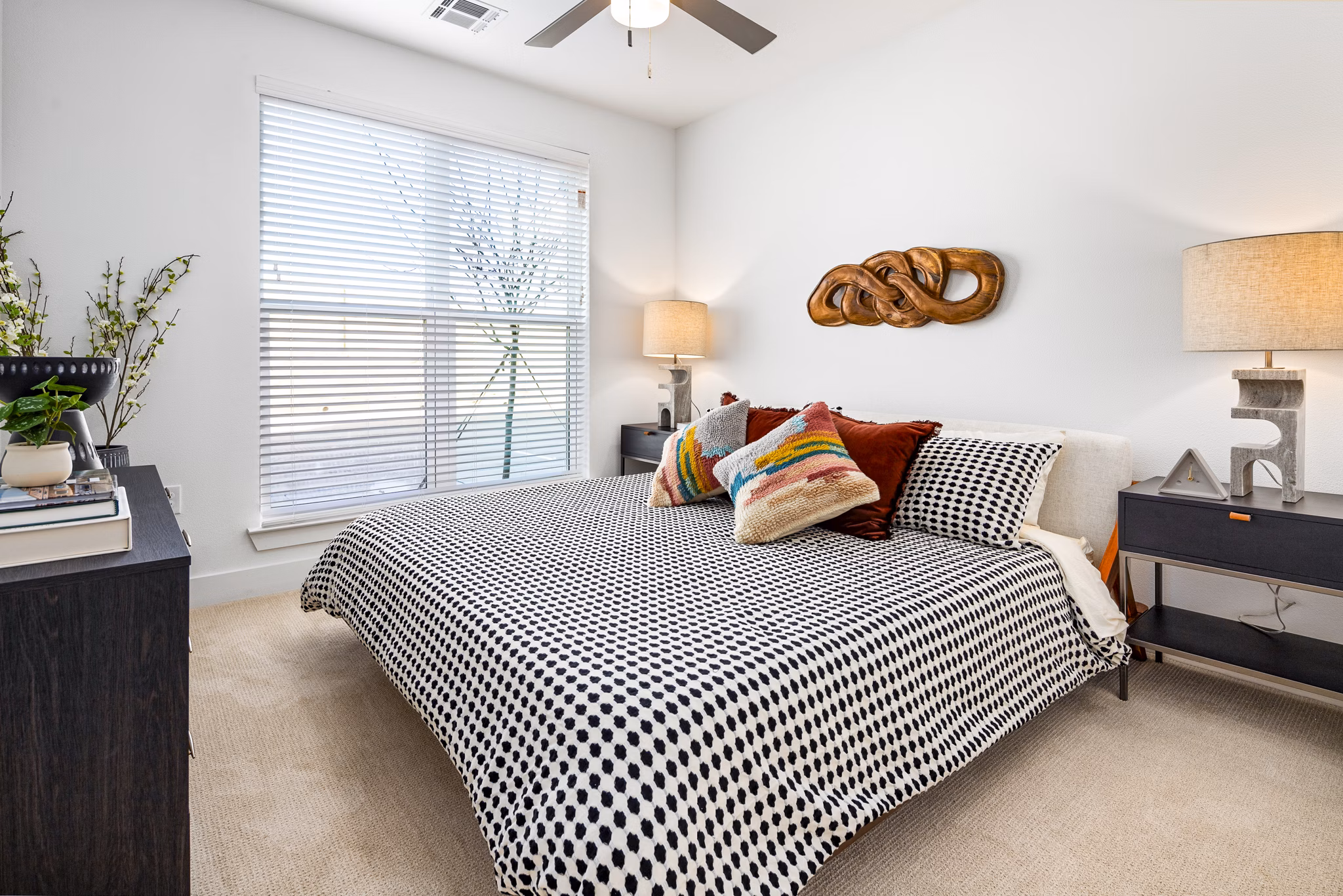 Cozy bedroom with modern furnishings in Rye Charlotte Ave Apartments, offering a luxurious living experience