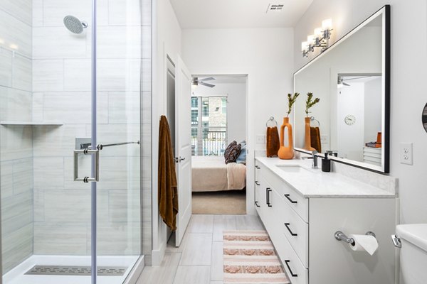 Modern bathroom with stylish fixtures at Rye Charlotte Ave Apartments