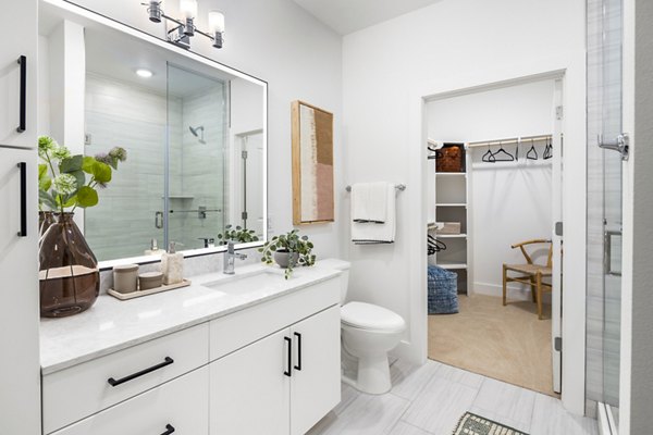 Modern bathroom with luxurious fixtures at Rye Charlotte Ave Apartments