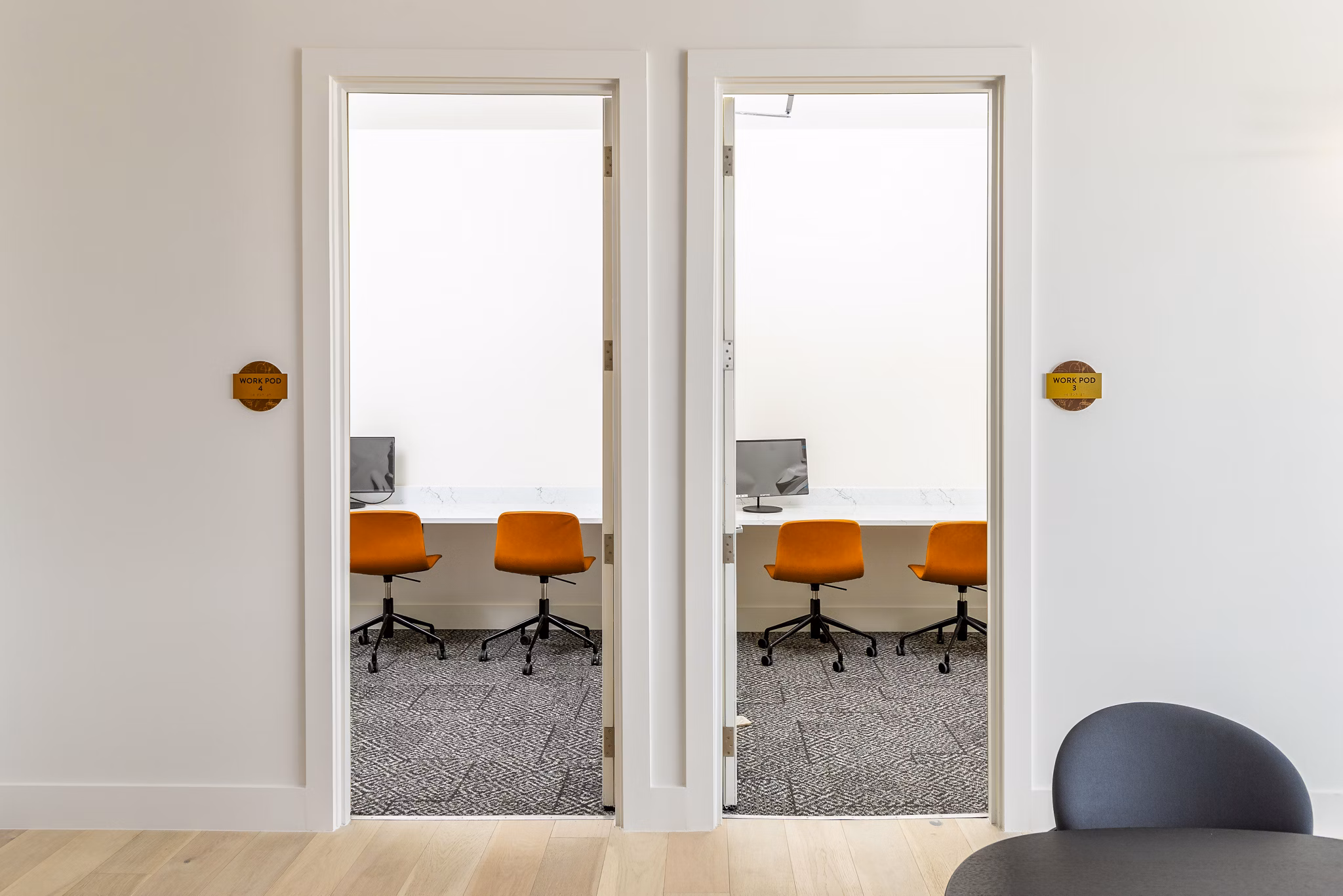 Clubhouse business center with modern workstations at Rye Charlotte Ave Apartments, offering luxury workspaces for residents
