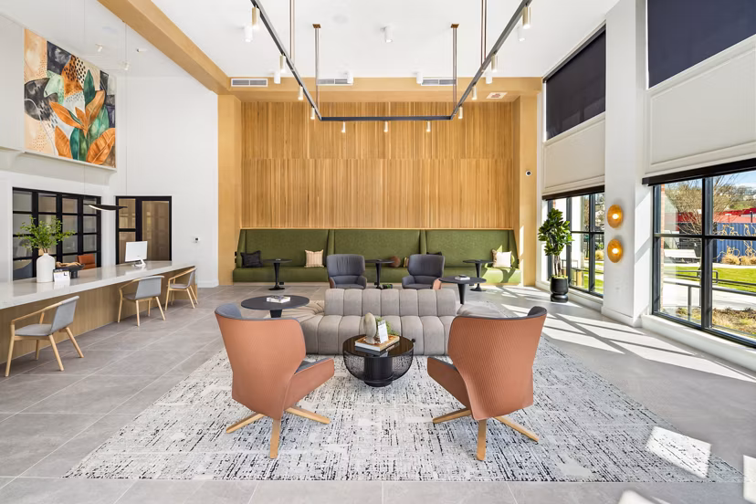 Clubhouse lounge with modern design and seating at Rye Charlotte Ave Apartments, a luxury property in Charlotte