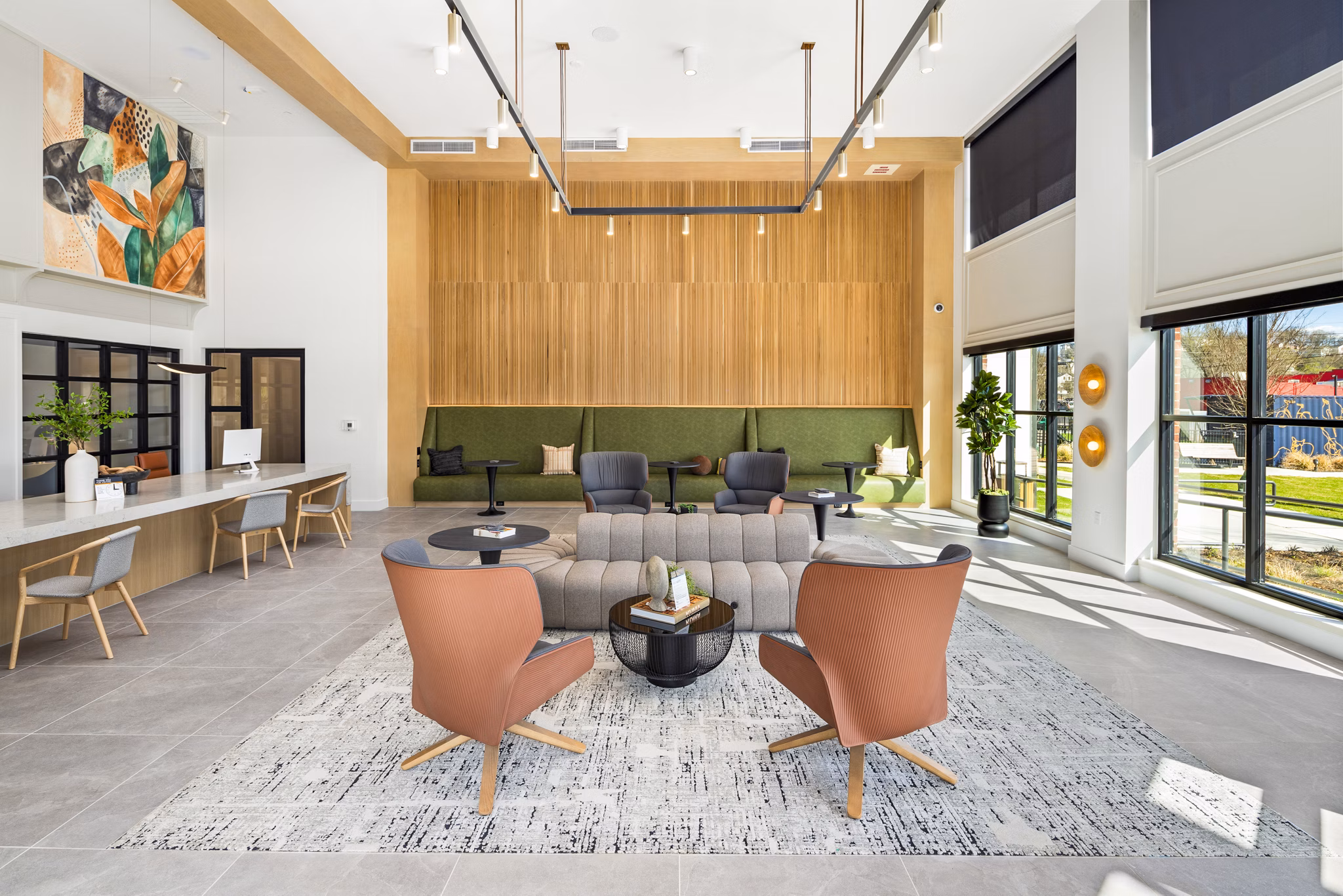 Clubhouse lounge with modern design and seating at Rye Charlotte Ave Apartments, a luxury property in Charlotte