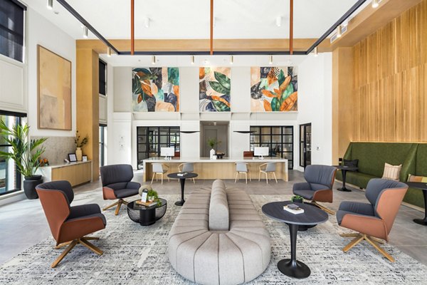 Modern clubhouse featuring stylish seating and dÃ©cor at Rye Charlotte Ave Apartments