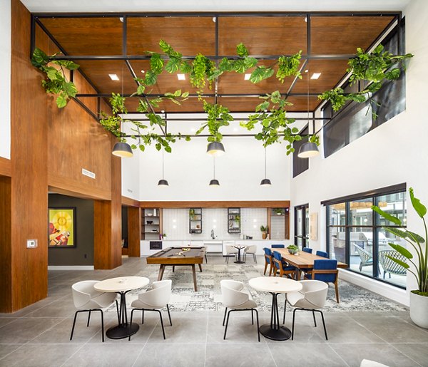 Elegant clubhouse with modern furnishings at Rye Charlotte Ave Apartments offering luxury gatherings and events