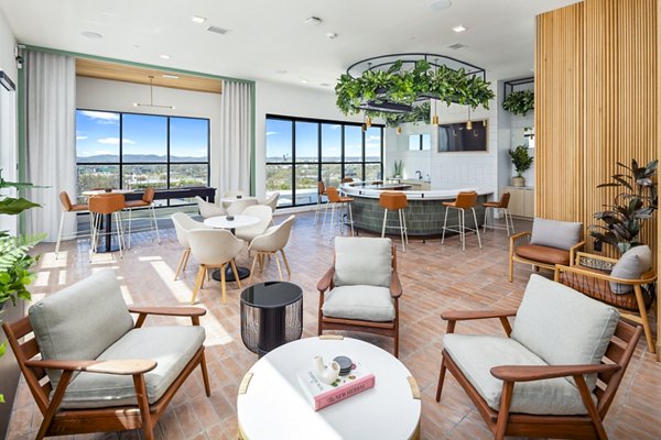 Modern clubhouse with stylish seating and recreational facilities at Rye Charlotte Ave Apartments, ideal for entertainment and relaxation
