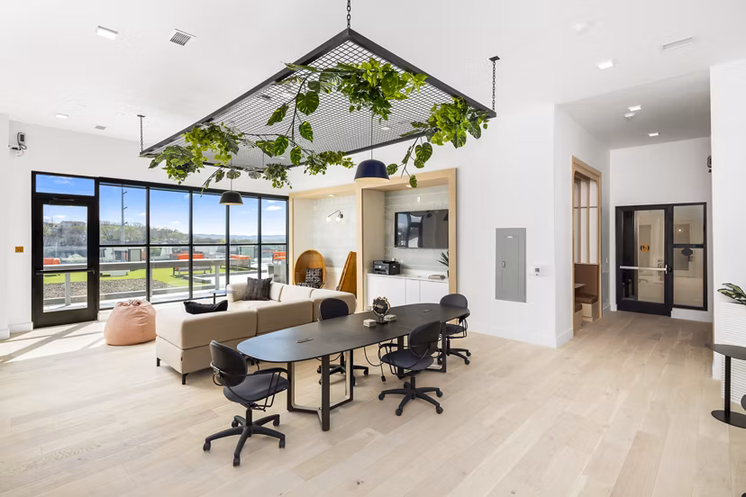 Clubhouse with modern interiors and seating at Rye Charlotte Ave Apartments, a Greystar luxury property