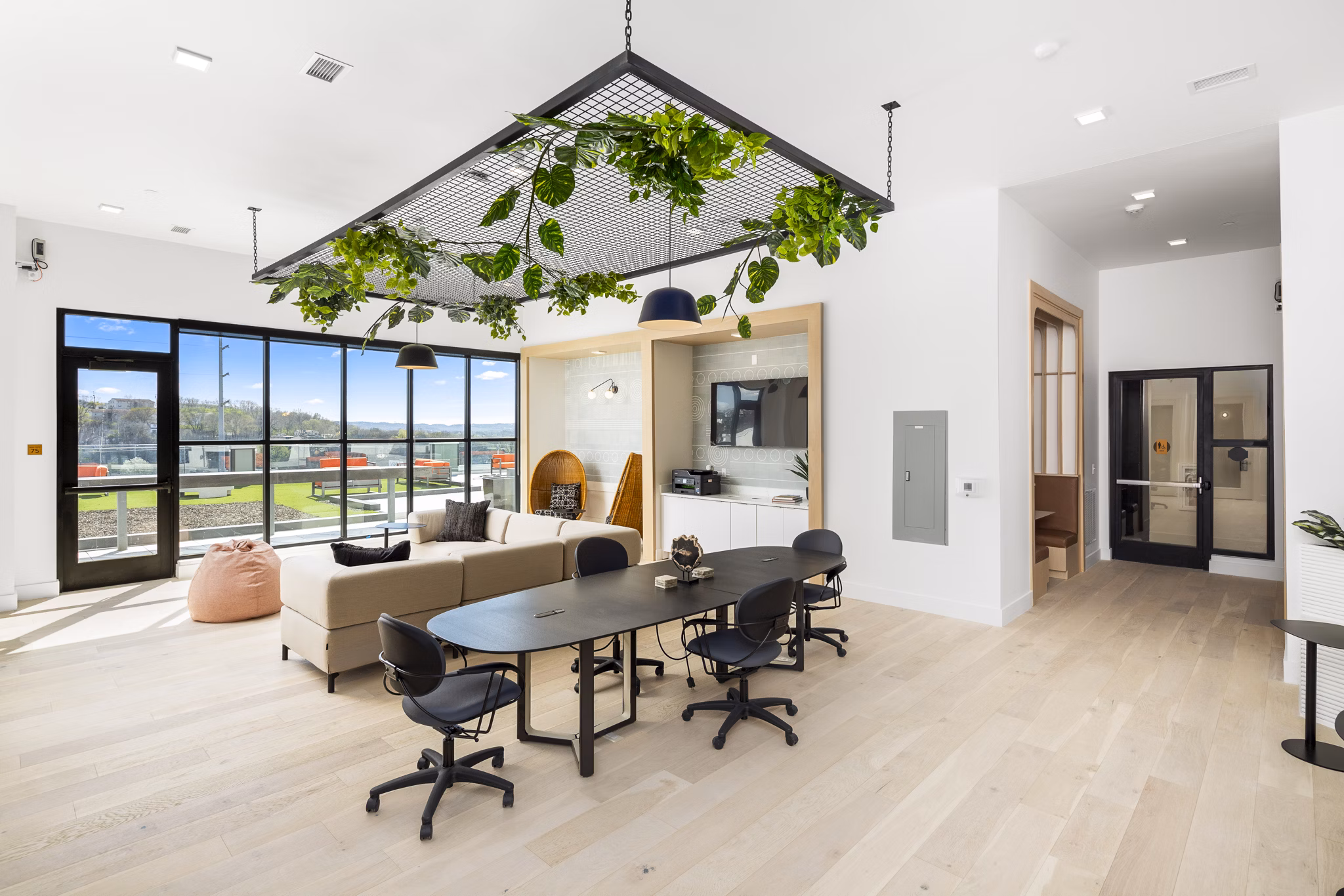 Clubhouse with modern interiors and seating at Rye Charlotte Ave Apartments, a Greystar luxury property