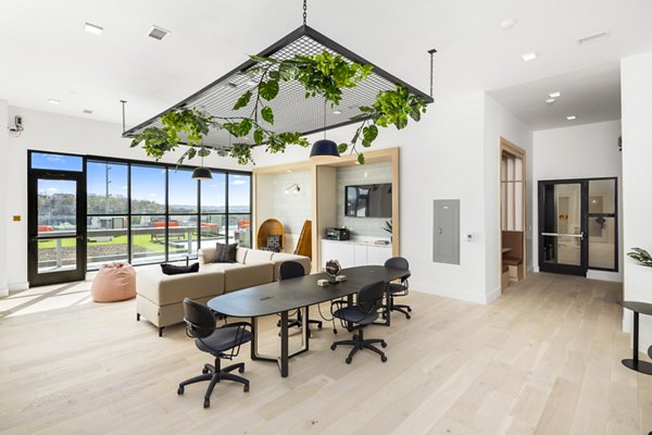 Clubhouse with modern interiors and seating at Rye Charlotte Ave Apartments, a Greystar luxury property