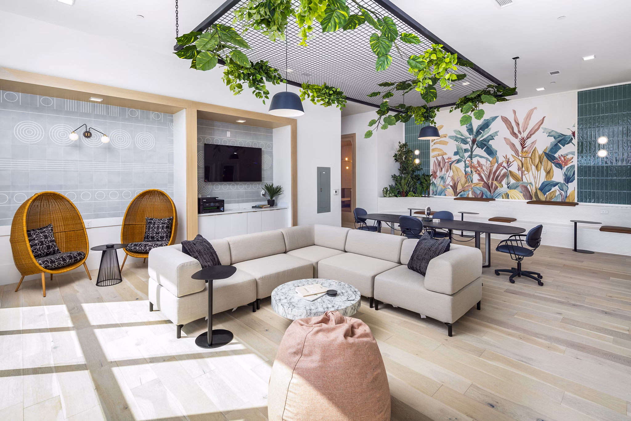 Modern clubhouse with seating areas and pool table at Rye Charlotte Ave Apartments