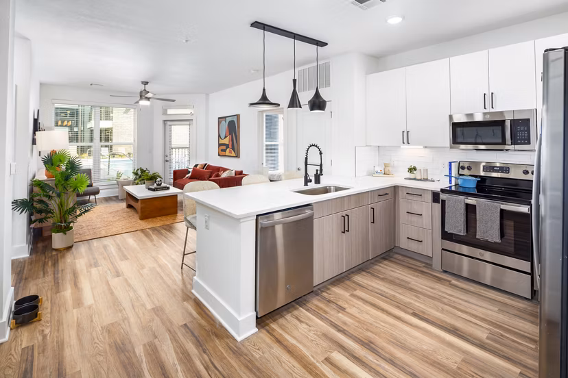 Modern kitchen with stainless steel appliances in Rye Charlotte Ave Apartments, luxury living by Greystar