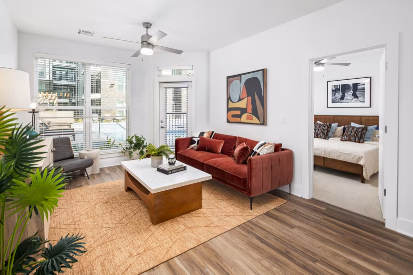 Spacious living room with modern furnishings at Rye Charlotte Ave Apartments