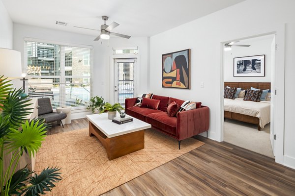 Spacious living room with modern furnishings at Rye Charlotte Ave Apartments
