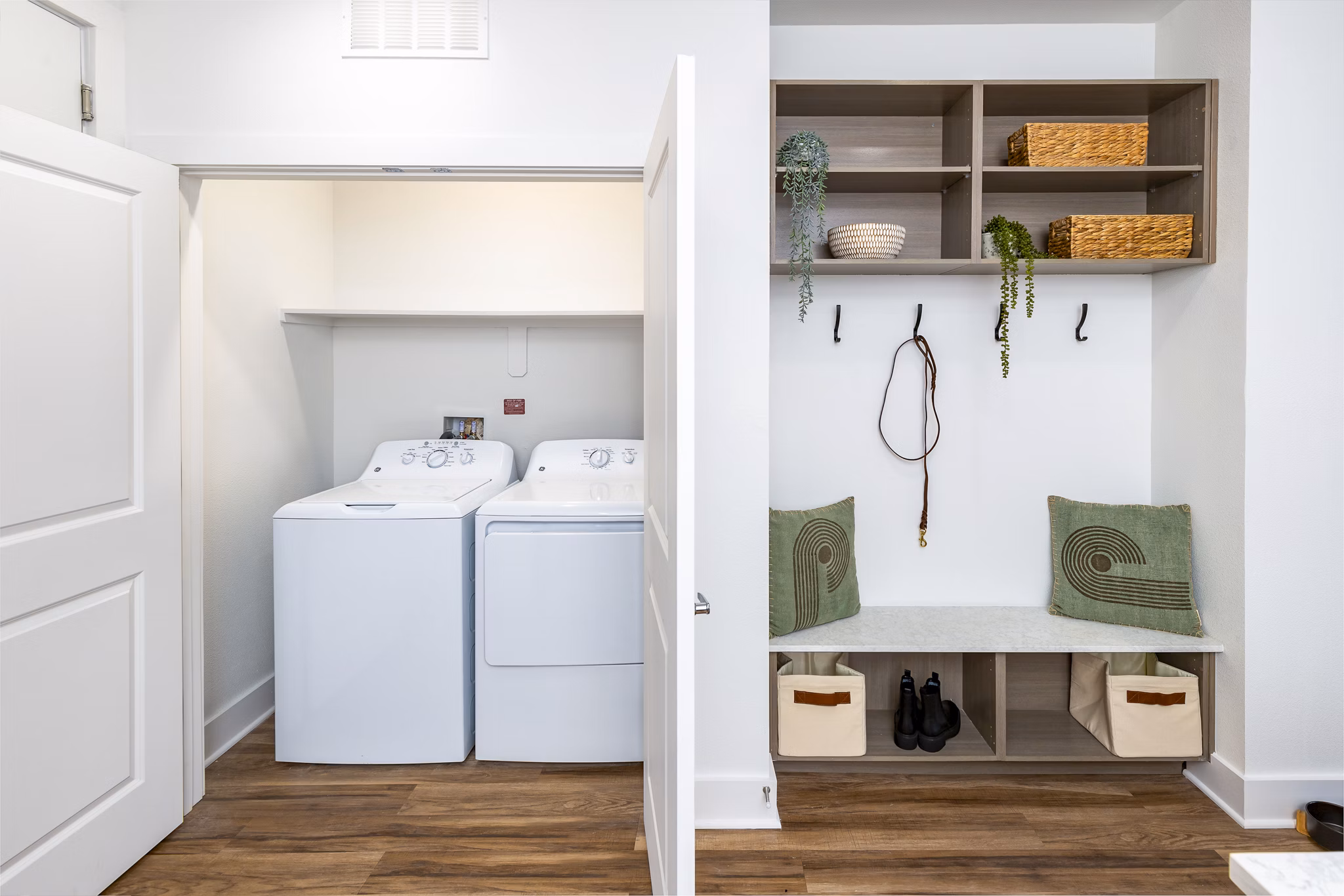 Laundry room with modern appliances at Rye Charlotte Ave Apartments in Greystar luxury apartment community