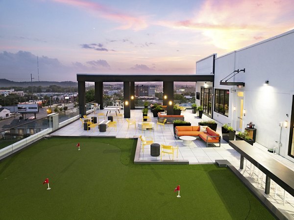 Modern recreational area with seating and game tables at Rye Charlotte Ave Apartments, a Greystar luxury community