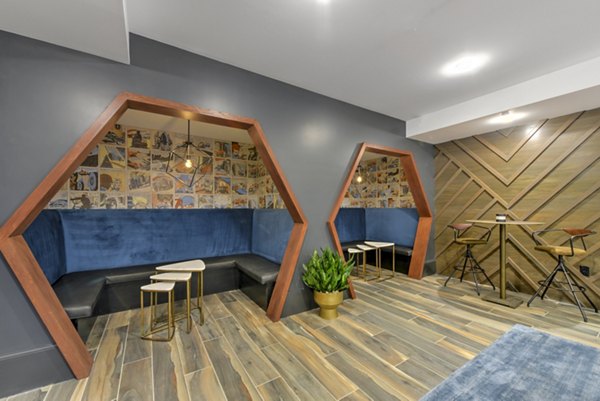Spacious clubhouse with modern design at Persea Apartments, ideal for community gatherings and events