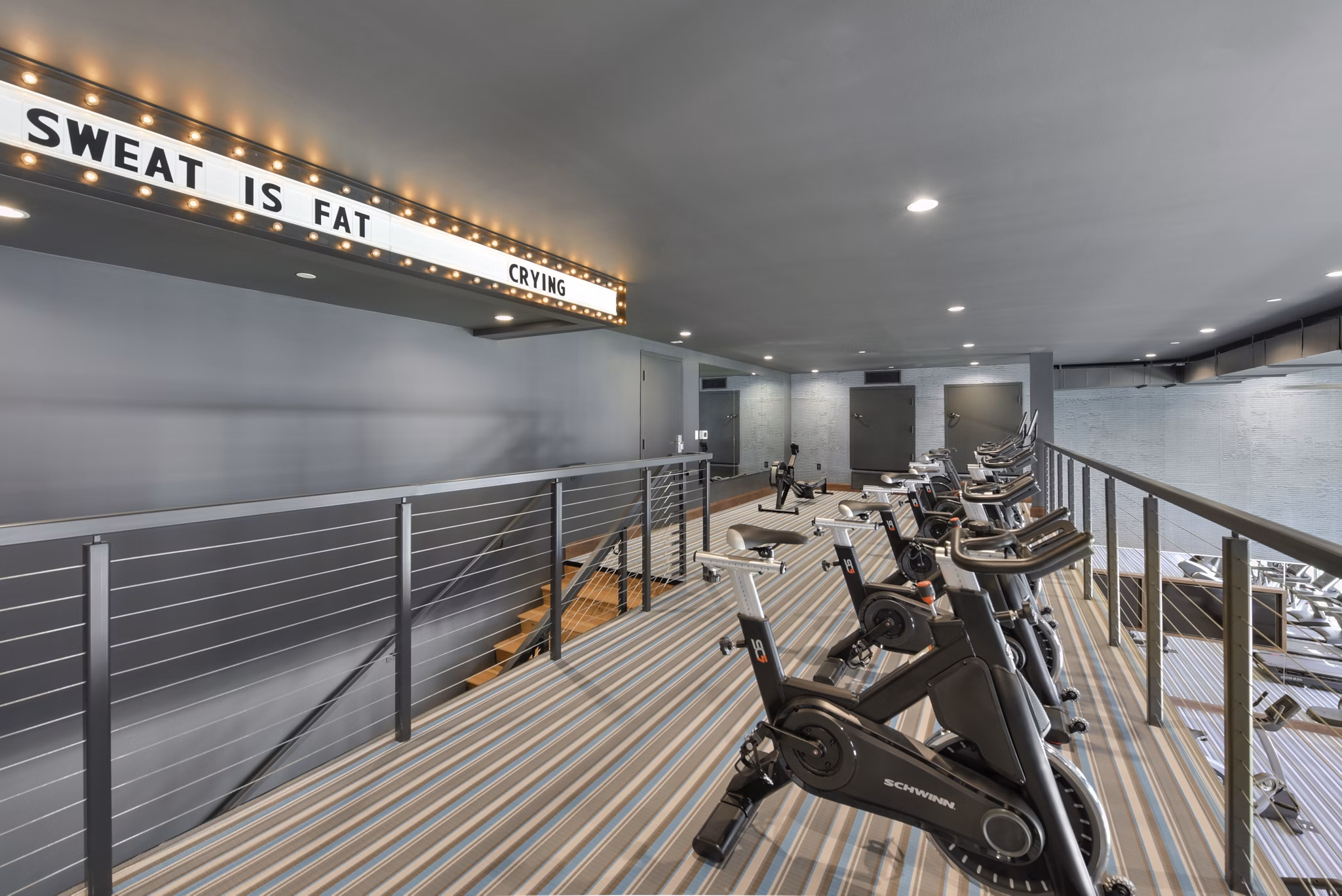 Modern fitness center with state-of-the-art equipment at Persea Apartments offers luxury workout spaces for residents