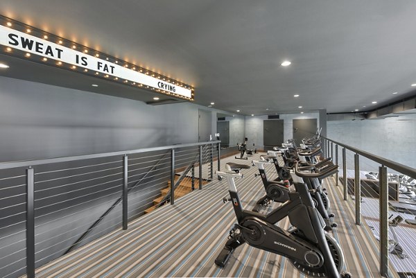 Modern fitness center with state-of-the-art equipment at Persea Apartments offers luxury workout spaces for residents