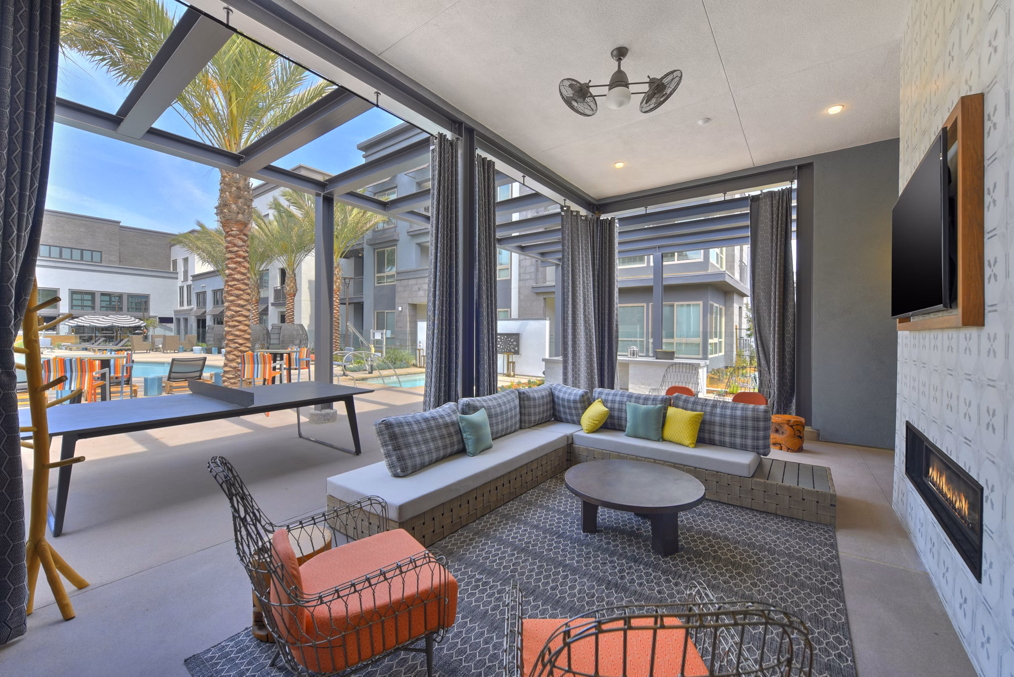 Chic outdoor patio with modern seating at Persea Apartments, offering a stylish retreat for residents