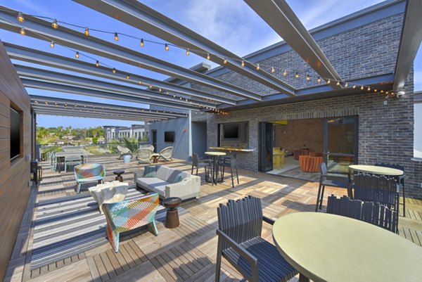 Persea Apartments: Modern rooftop deck offering city views