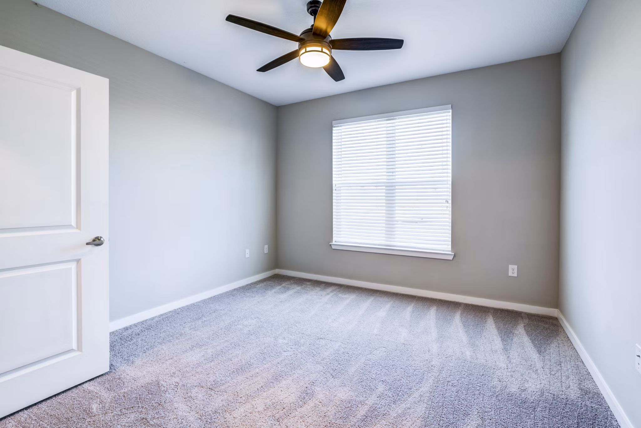 Cozy bedroom with modern decor at The Pointe at Siena Ridge Apartments