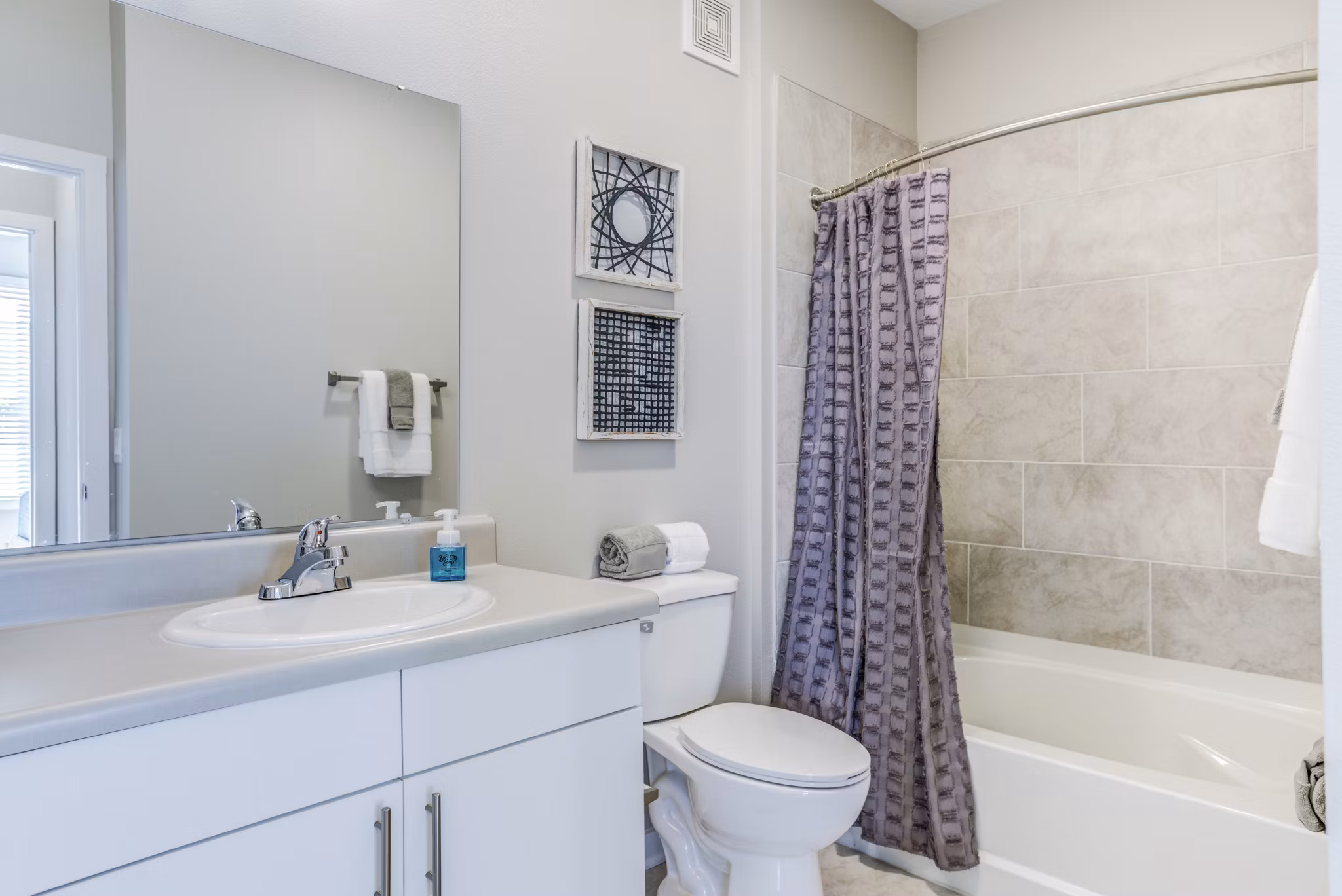 Modern bathroom with sleek fixtures at The Pointe at Siena Ridge Apartments, showcasing luxury living in a premium community