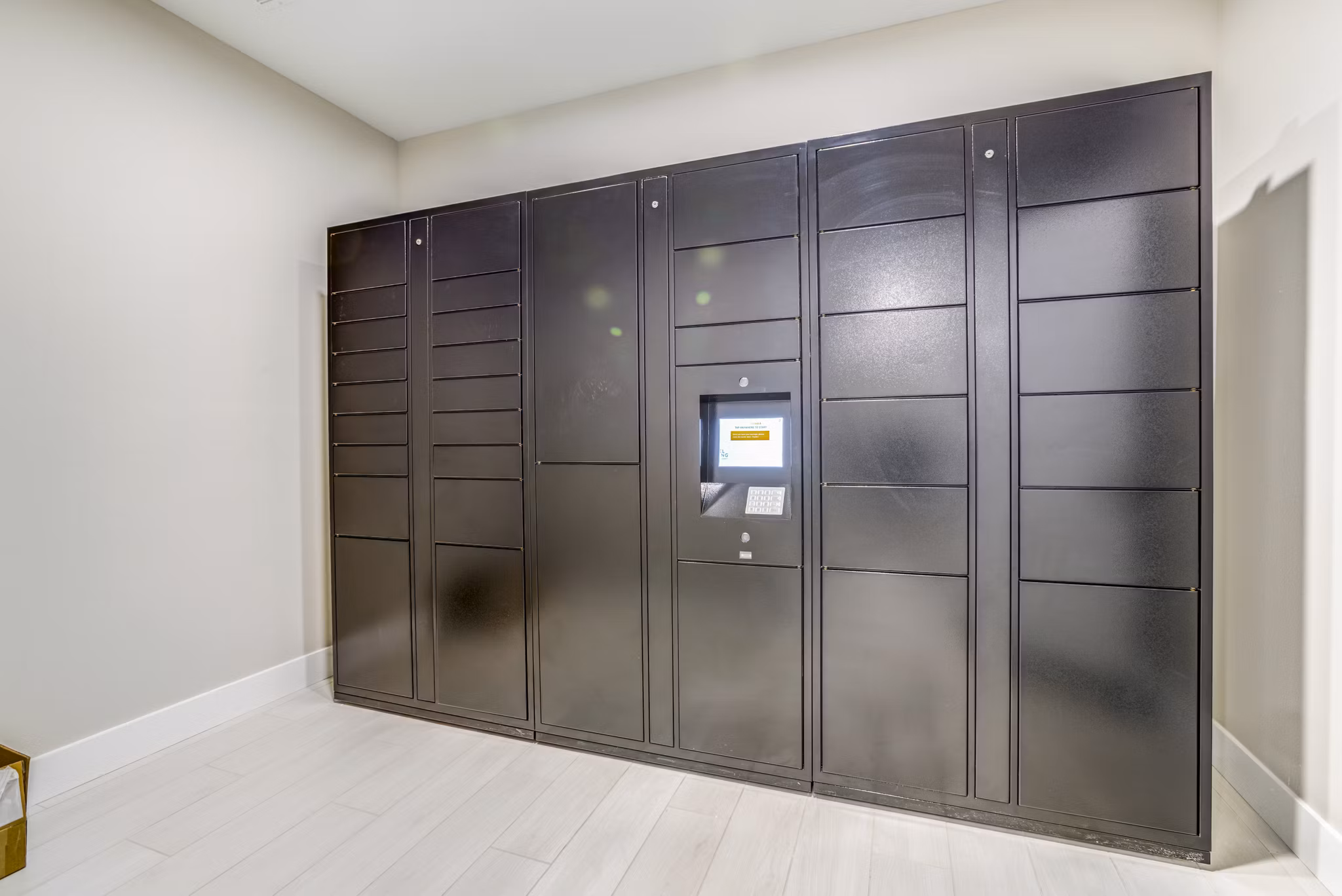 Secure parcel package pickup locker at The Pointe at Siena Ridge Apartments