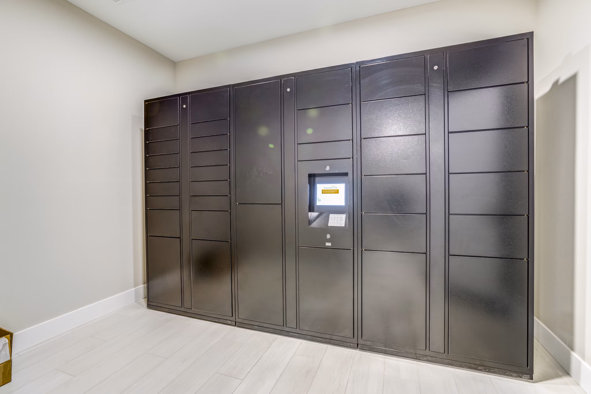Secure parcel package pickup locker at The Pointe at Siena Ridge Apartments