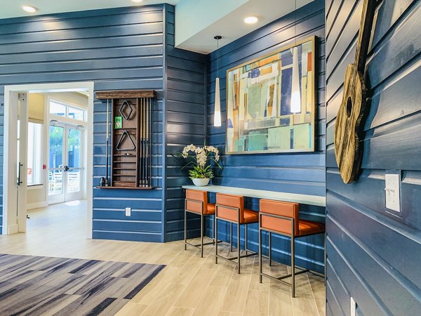 The Pointe at Siena Ridge: Elegant clubhouse lobby with modern furnishings and ample natural light, luxury apartment living