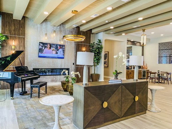 Clubhouse lobby with modern seating and decor at The Pointe at Siena Ridge Apartments