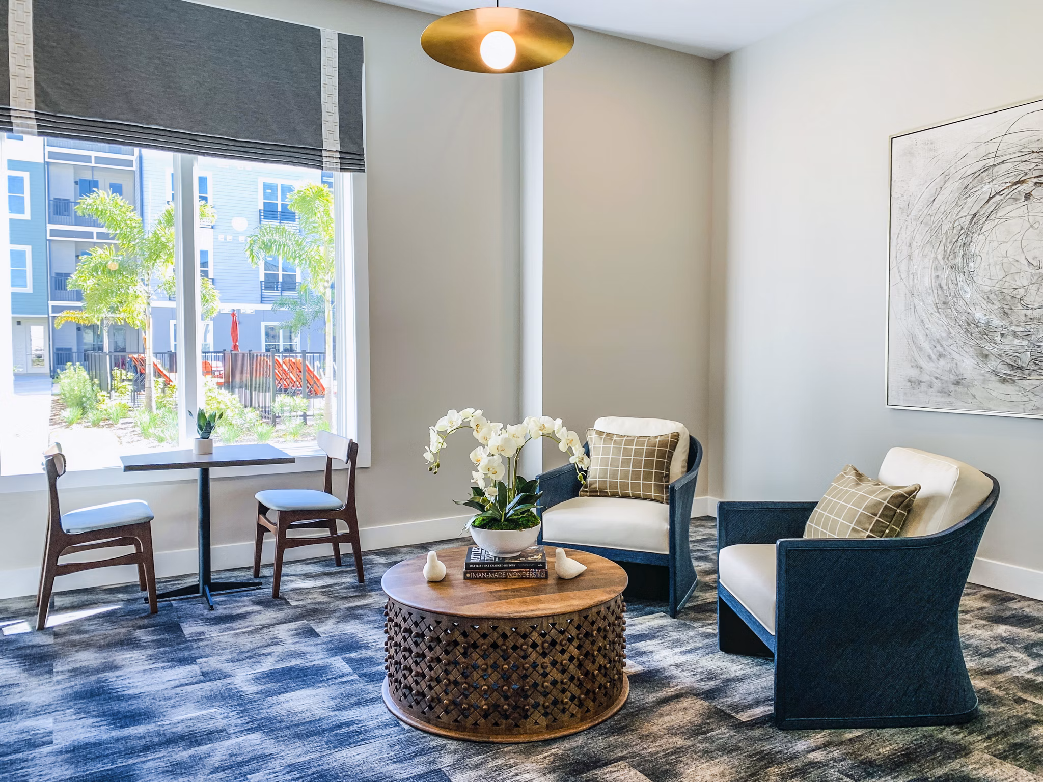 The Pointe at Siena Ridge Apartments: Modern clubhouse with welcoming lobby and stylish seating areas
