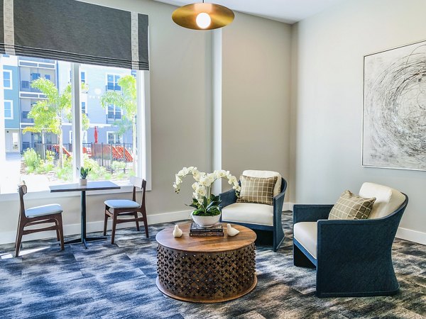 The Pointe at Siena Ridge Apartments: Modern clubhouse with welcoming lobby and stylish seating areas