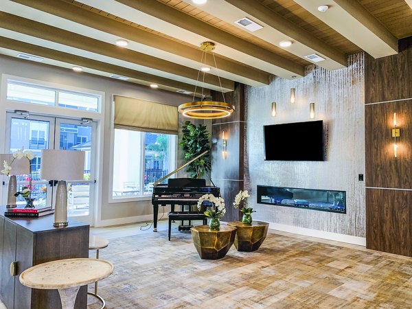 The Pointe at Siena Ridge Apartments: Elegant clubhouse lobby with modern decor and plush seating