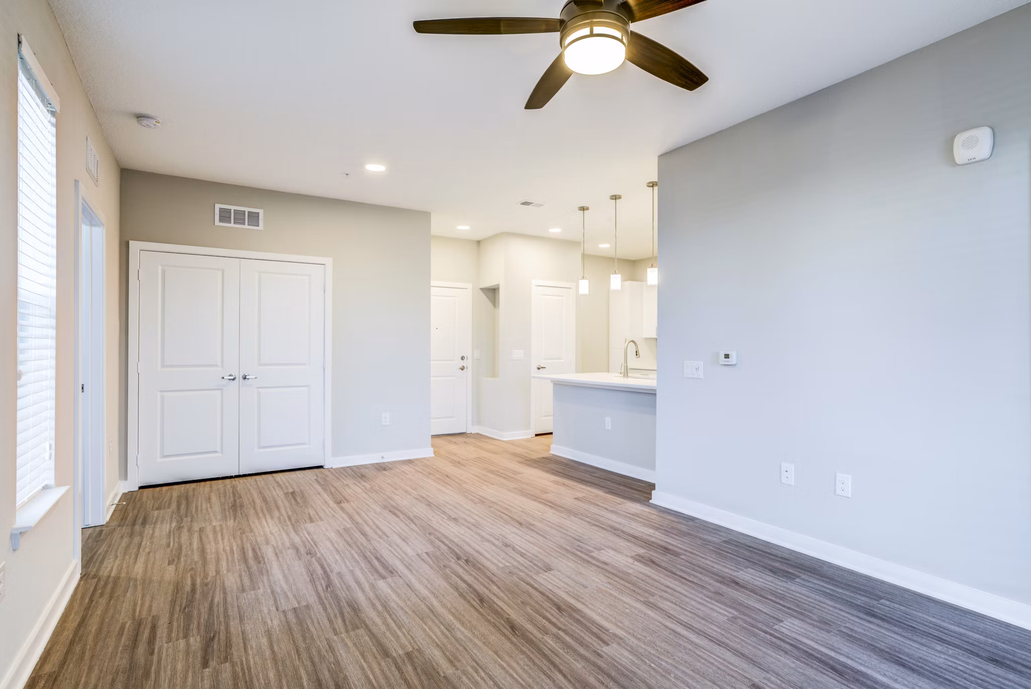 Spacious living room with modern decor at The Pointe at Siena Ridge Apartments