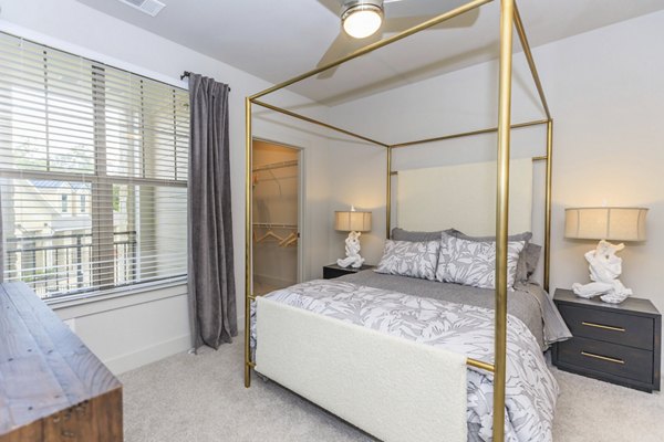 Cozy bedroom with modern decor at Reserve at Lake Jackson Apartments