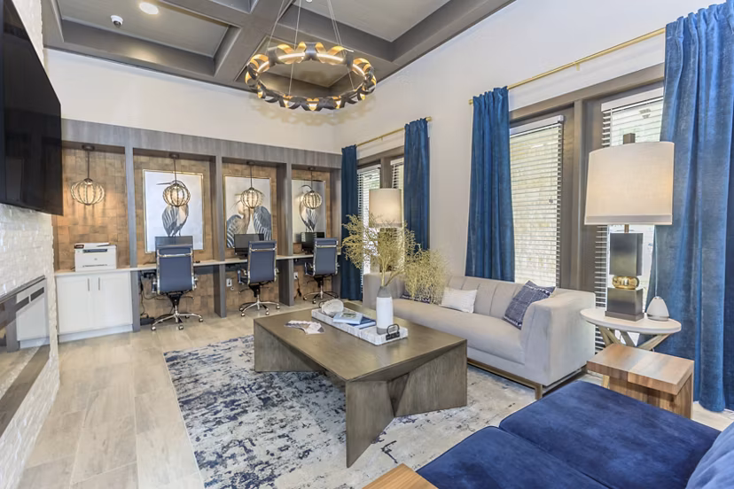 Clubhouse at Reserve at Lake Jackson Apartments: Elegant social space with modern amenities and comfortable seating in a vibrant community setting