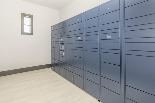 Modern mail room with organized lockers at Reserve at Lake Jackson Apartments