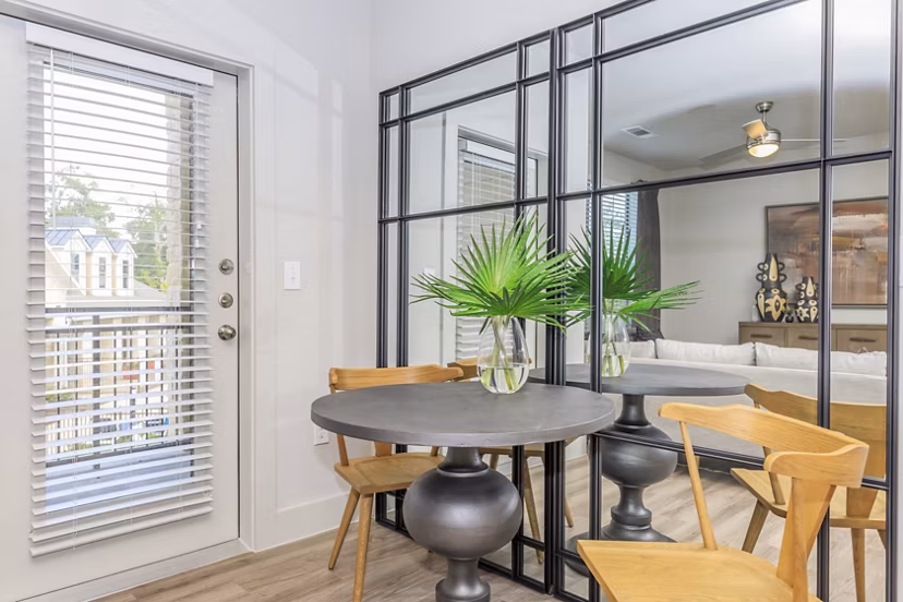 Dining area with modern decor and ample seating at Reserve at Lake Jackson Apartments