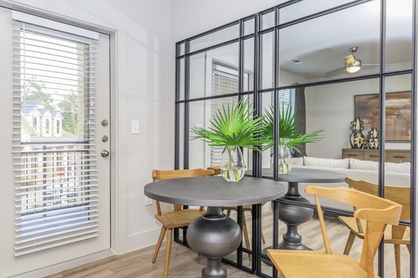 Dining area with modern decor and ample seating at Reserve at Lake Jackson Apartments