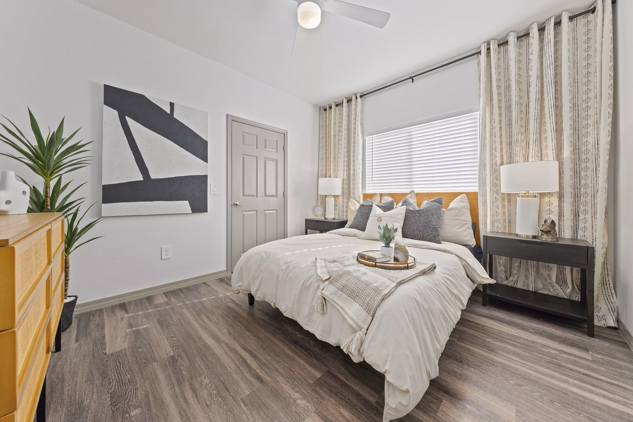 Cozy bedroom with modern decor in Cardinal 95 Apartments, offering luxury living spaces with stylish design elements