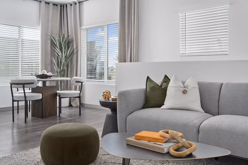 Clubhouse lounge with modern design and gaming area at Cardinal 95 Apartments in Greystar community