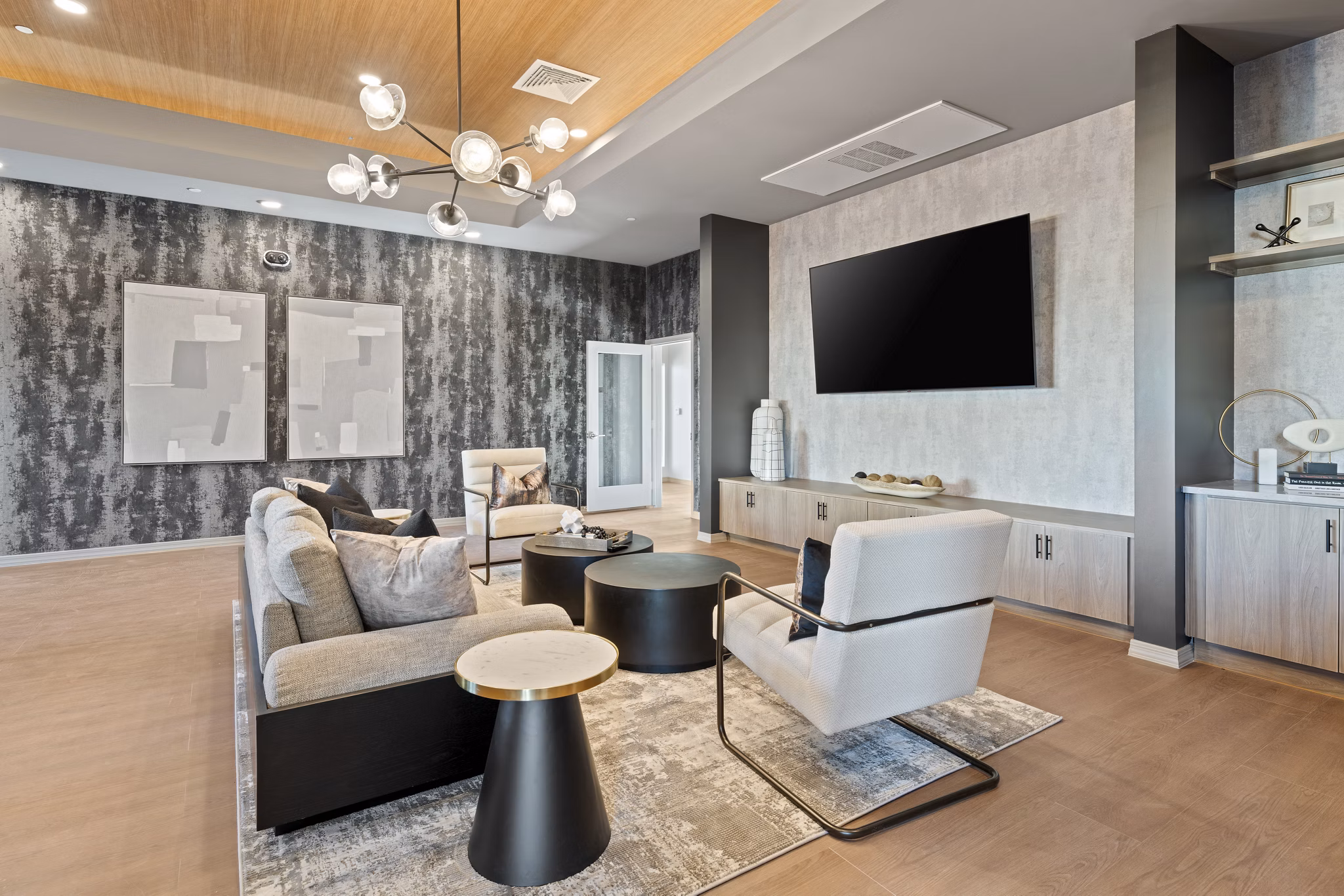 Clubhouse interior with modern seating and entertainment area at Cardinal 95 Apartments, highlighting luxurious community gathering space