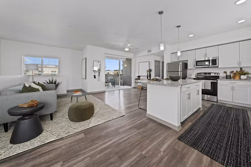 Kitchen with modern appliances and granite countertops at Cardinal 95 Apartments luxury homes