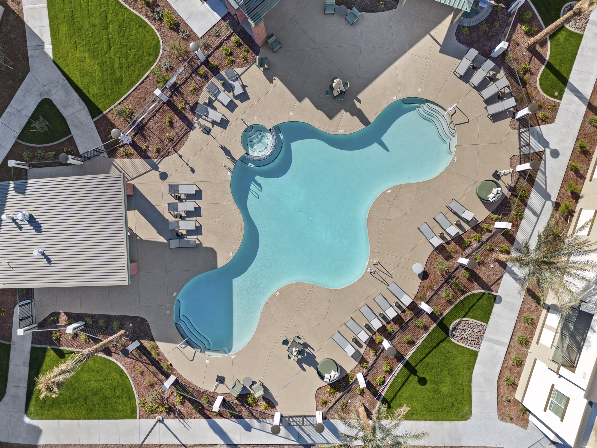 Modern pool with lounge chairs at Cardinal 95 Apartments, perfect for relaxation and leisure