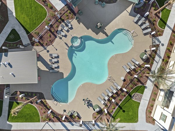 Modern pool with lounge chairs at Cardinal 95 Apartments, perfect for relaxation and leisure