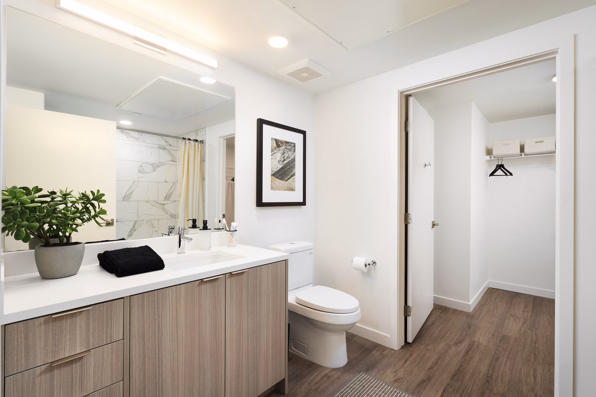 Bathroom featuring modern fixtures and elegant tilework in The Hayden Apartments
