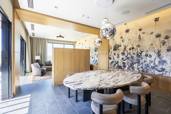 Meeting facility featuring modern seating and high-tech equipment at The Hayden Apartments, a luxury apartment community by Greystar