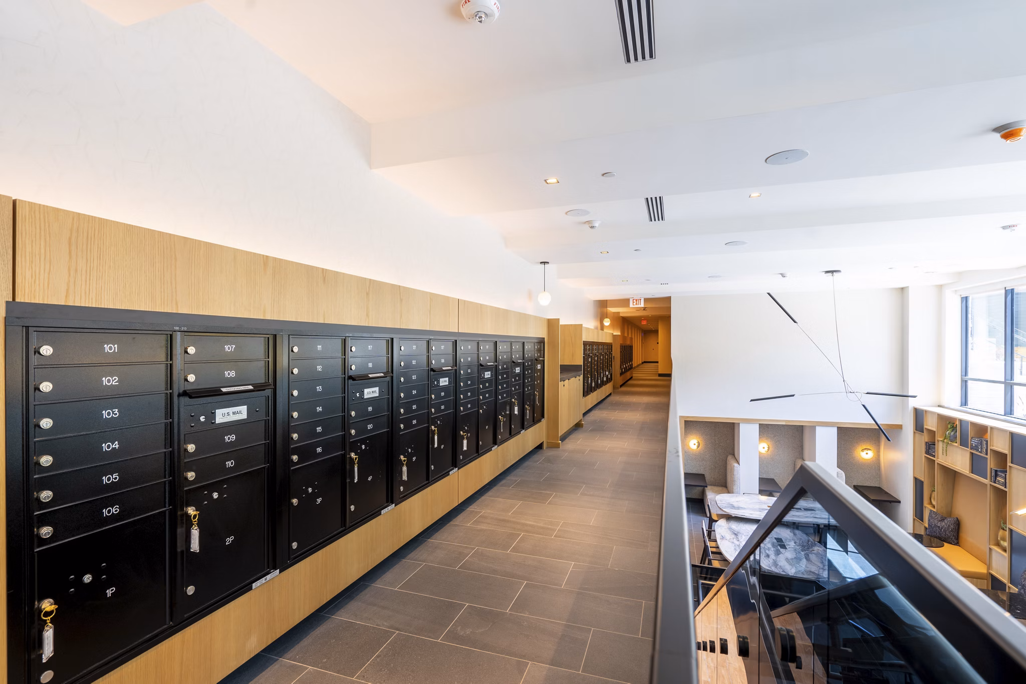 Mailroom with sleek design and individual mail slots at The Hayden Apartments, showcasing a convenient amenity for residents