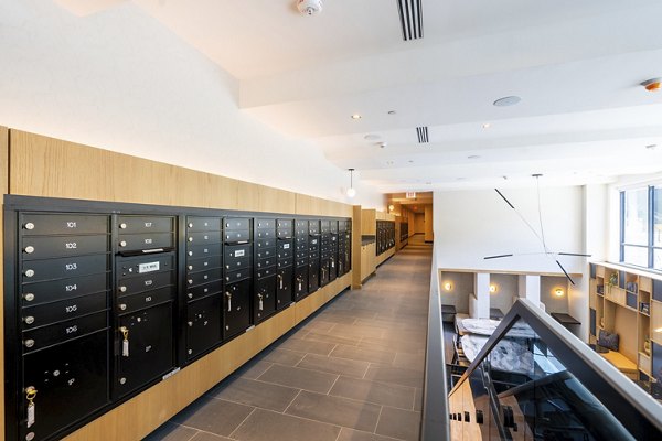 Mailroom with sleek design and individual mail slots at The Hayden Apartments, showcasing a convenient amenity for residents
