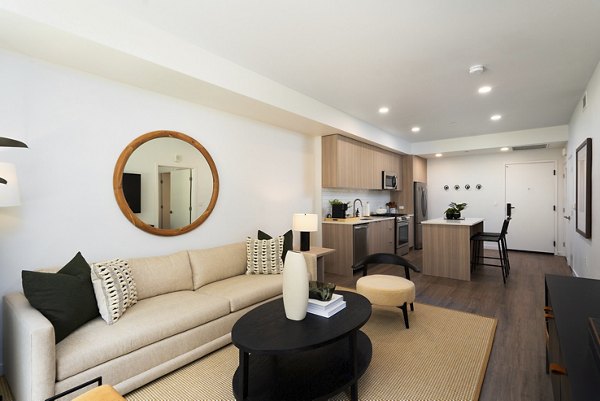 Bright and airy living room with modern furnishings at The Hayden Apartments