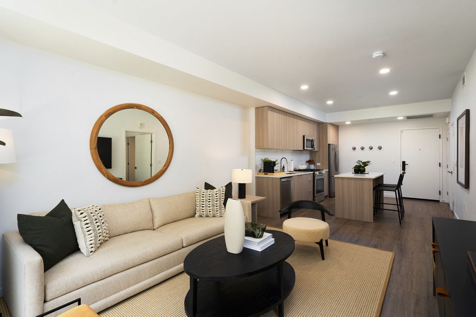 Bright and airy living room with modern furnishings at The Hayden Apartments